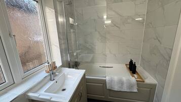 Shower, hair dryer, towels, soap