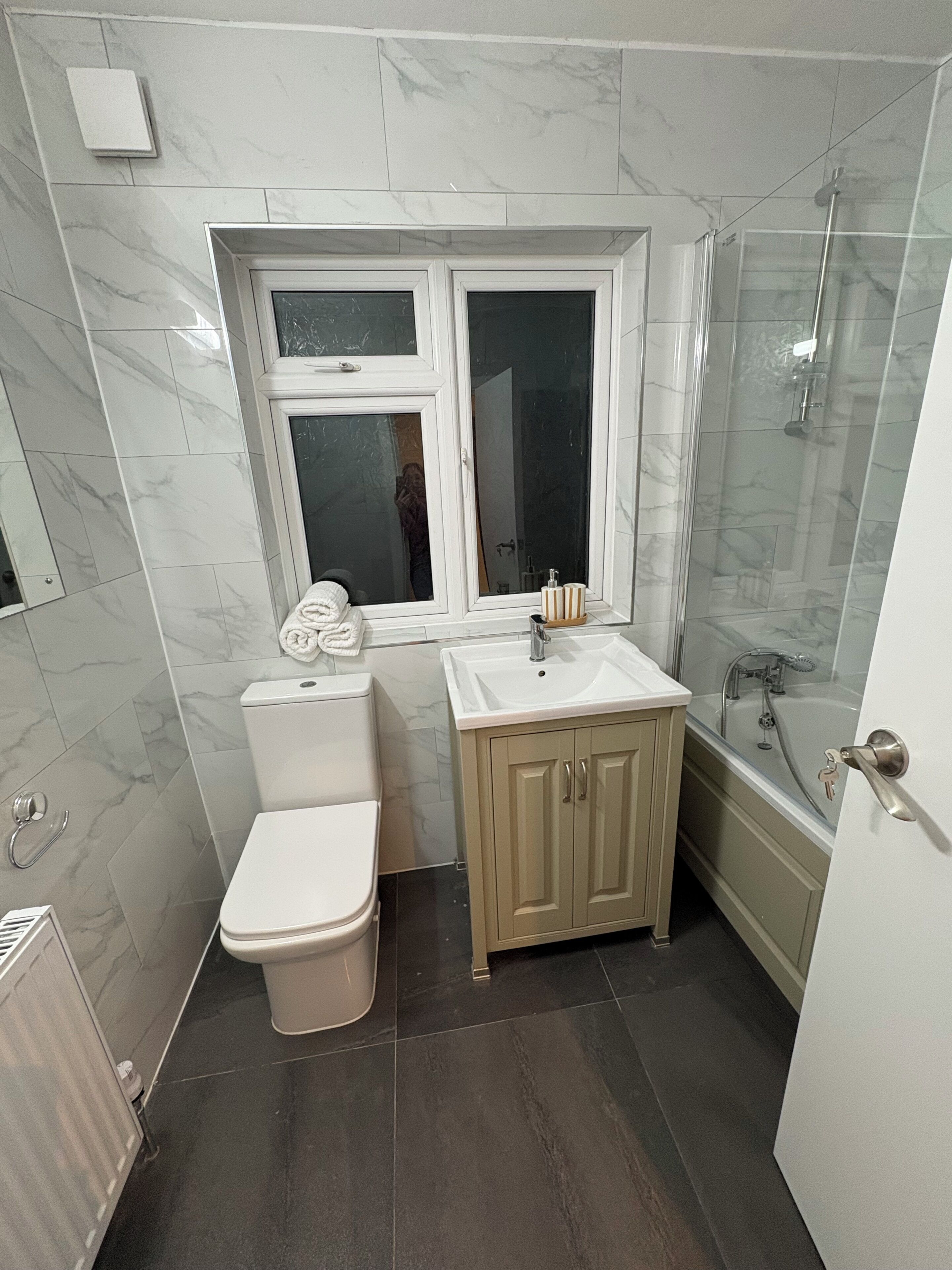 Shower, hair dryer, towels, soap
