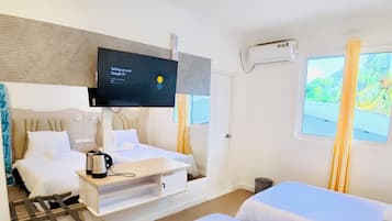 Chambre Deluxe double ou avec lits jumeaux | Minibar, coffre-fort, fer et planche à repasser, accès au Wi-Fi (inclus)