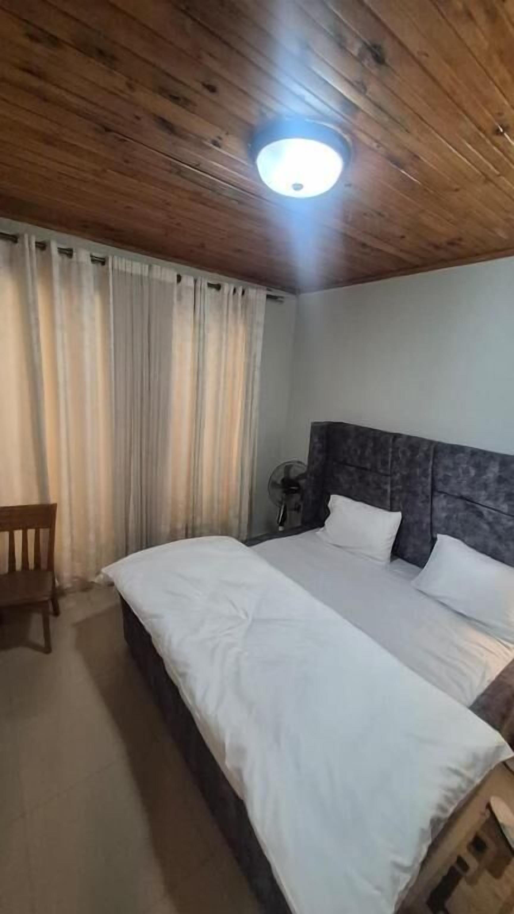 Blackout drapes, iron/ironing board (on request)