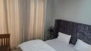 Blackout drapes, iron/ironing board (on request)