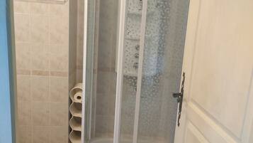 Shower, towels, soap, toilet paper