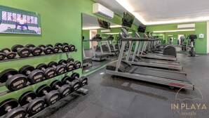 A gym with treadmills, dumbbells, and exercise machines. - Quiet Pool-View 1BR Near 5th Avenue (Playa del Carmen)