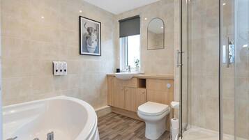 Shower, hair dryer, towels, shampoo