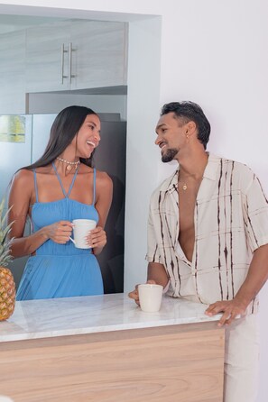 A modern kitchen with marble countertops, stainless steel appliances, and wooden cabinets. - Luxury 4BR Punta Cana Villa | Private Pool & Beach Access (Punta Cana)