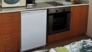 A compact kitchen with wooden cabinets, a small refrigerator, a coffee maker, and a microwave. - Studio in Cedar Lodge 3 (Bansko)