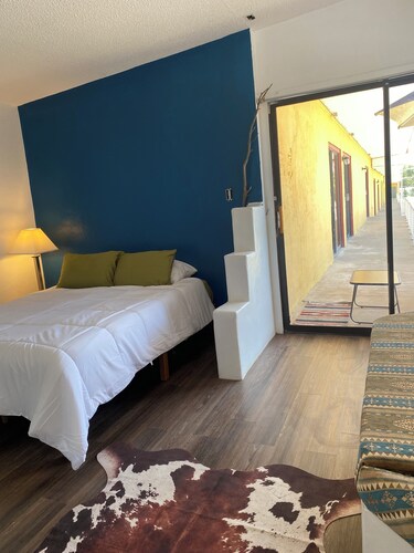 The Banco Room, a handcrafted Southwest retreat with  Adobe bancos & Kiva frplc