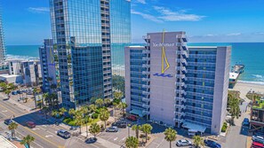 A high-rise hotel with balconies, a marina, and a beach view. - Myrtle Blue Retreat 1BR Oceanfront Yachtsman 905 (Myrtle Beach)