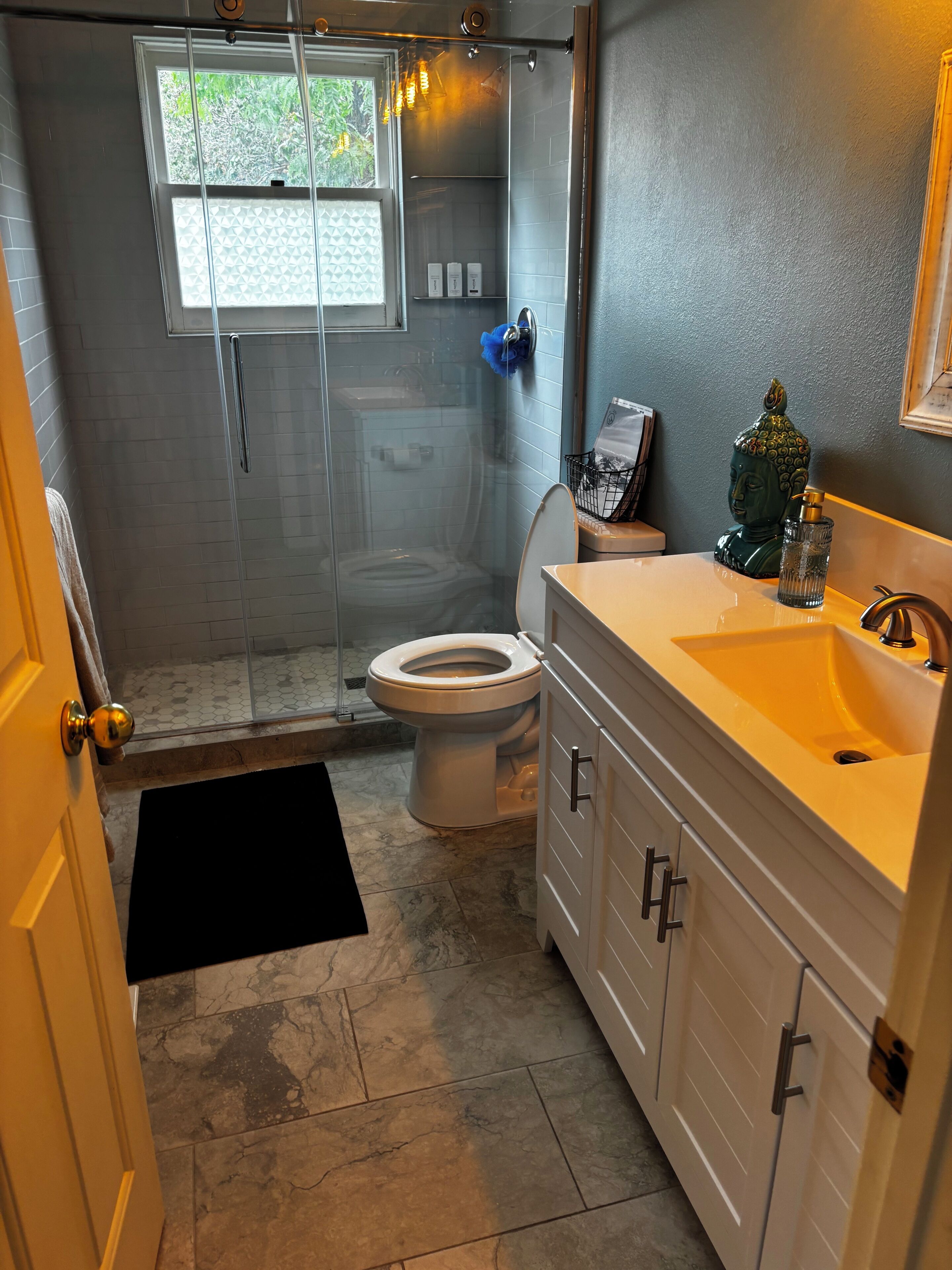 Shower, hair dryer, towels, soap