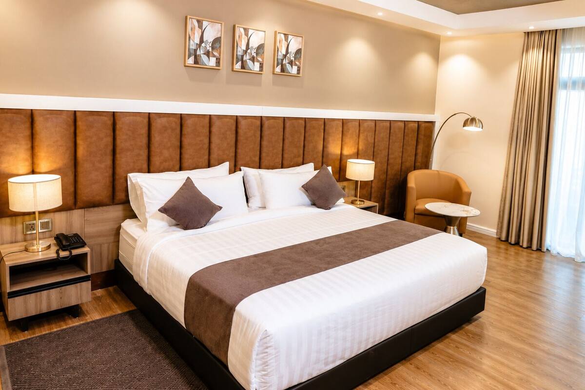 Deluxe Room, Garden View | In-room safe, desk, laptop workspace, iron/ironing board (on request)