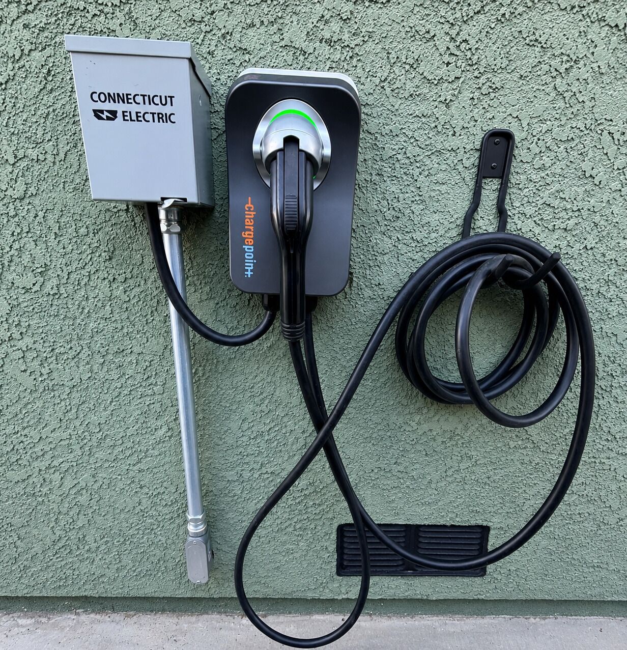 A Connecticut Electric charging station with a cable and a plug.