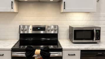 Coffee/tea maker, fridge, microwave, oven