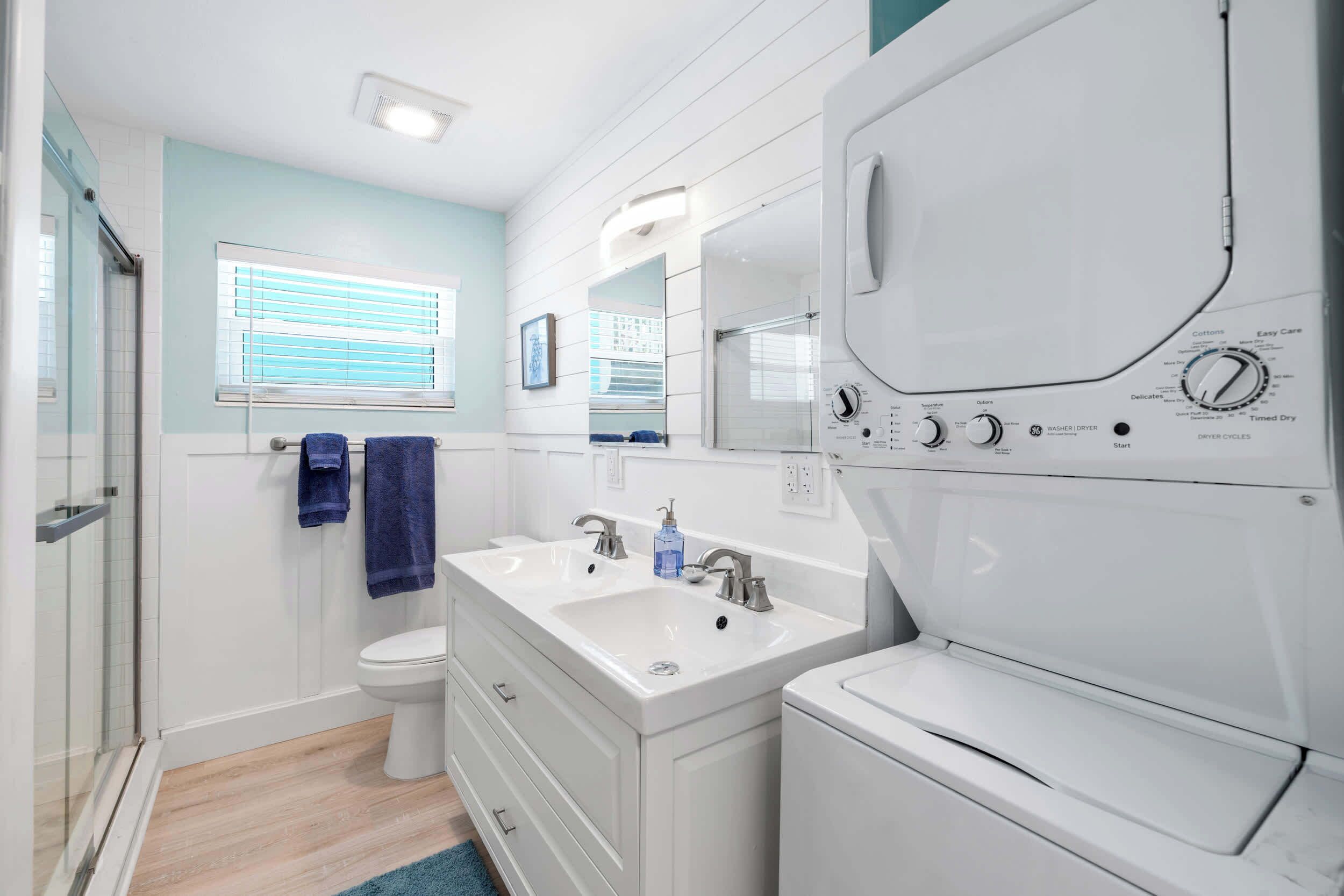 Shower, hair dryer, towels, shampoo