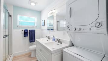 Shower, hair dryer, towels, shampoo
