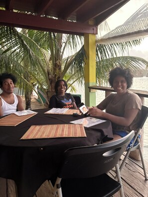 Outdoor dining - D'Horizon Comfort Suites: Family-friendly 2 bedroom apartments with Ocean Views (Calibishie)