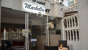 A hotel entrance with a sign reading 'Hostal Marbella 47'. - Hostal Marbella 47 (Cartagena)