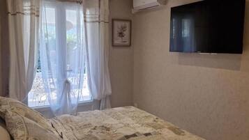 3 habitaciones, tabla de planchar con plancha y acceso a internet