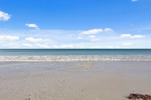 A beach with a clear sky and calm sea. - Estero Beach & Tennis -NEW LISTING- Every Stay Comes with a WATERFRONT VIEW 405C (Fort Myers Beach)