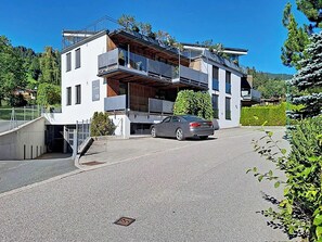 A modern two-story building with a car parked in front. - Das Weidach by Interhome (Brixen im Thale)