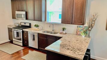 Coffee/tea maker, fridge, microwave, oven