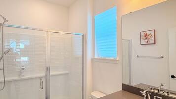 Shower, hair dryer, towels, soap