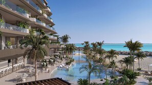 Un complexe hôtelier doté d’une piscine, de palmiers et offrant une vue sur la plage.