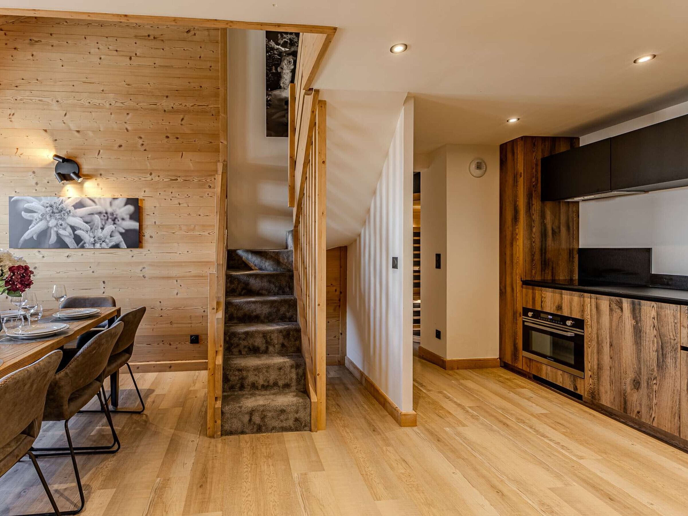 A modern kitchen with wooden cabinetry and a built-in oven.