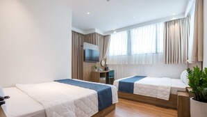 Quarto duplo | Escrivaninha, Wi-Fi de cortesia, roupa de cama