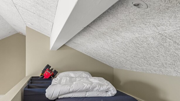 A compact room with a bed, a small table, and a toy car. - "Illona" - 200m from the sea by Interhome (Hejls)