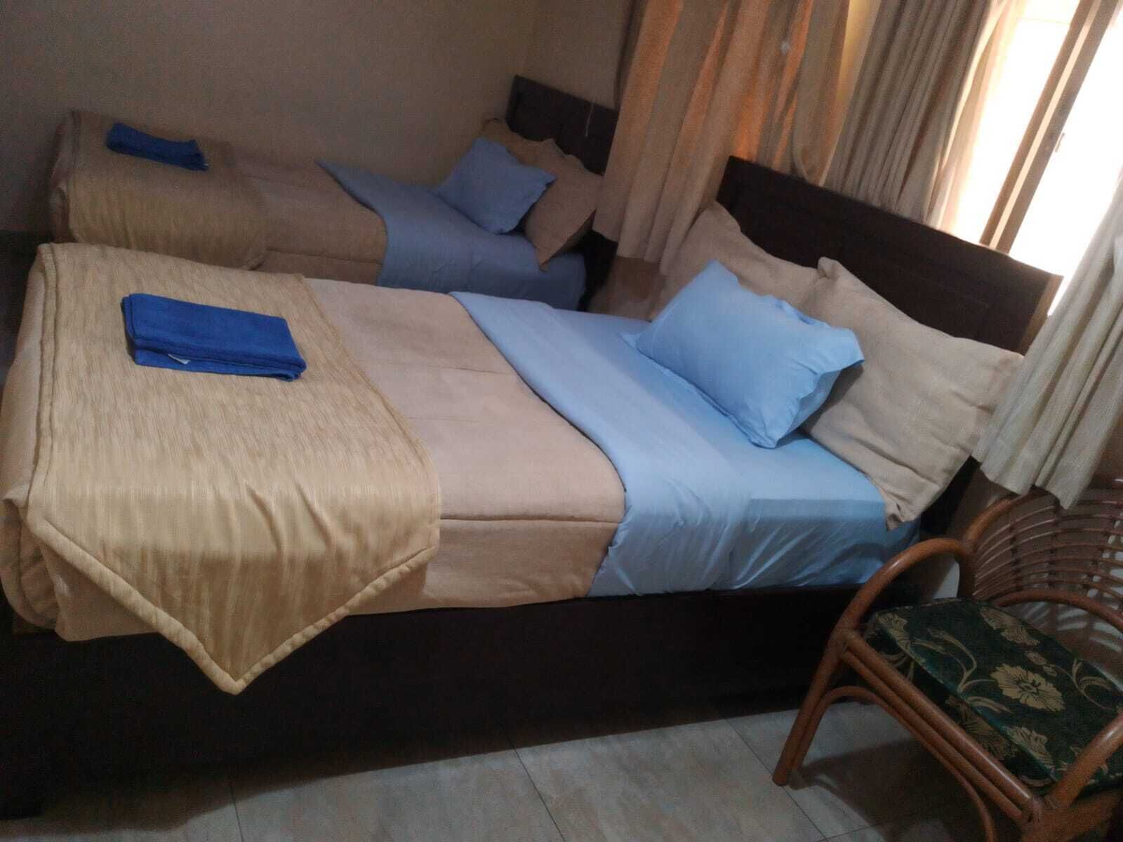 Premium bedding, pillow-top beds, desk, laptop workspace