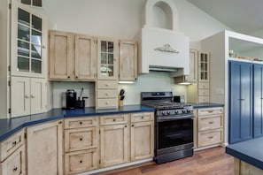 A kitchen with wooden cabinets, a stove, and a microwave. - Riffle Road Ranch: 10 Acres, 8 Mi to Silverwood (Spirit Lake)