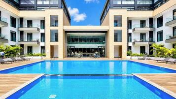 Deluxe Studio, City View | Pool | 3 outdoor pools