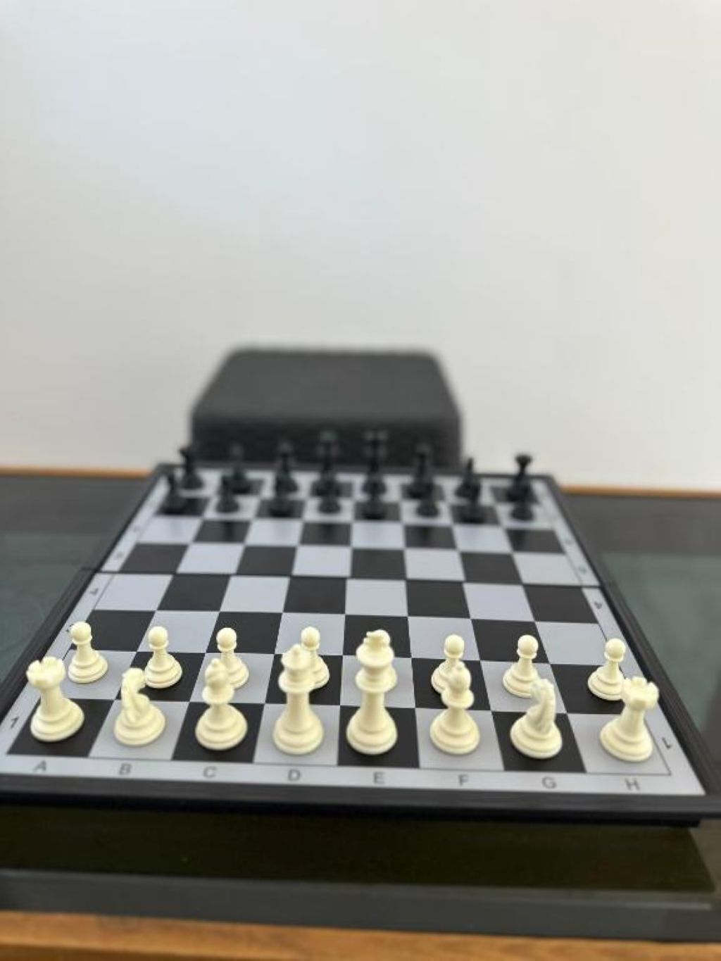 A chessboard with pieces set up for a game.