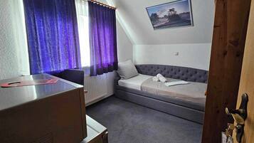 Desk, laptop workspace, blackout curtains, free WiFi