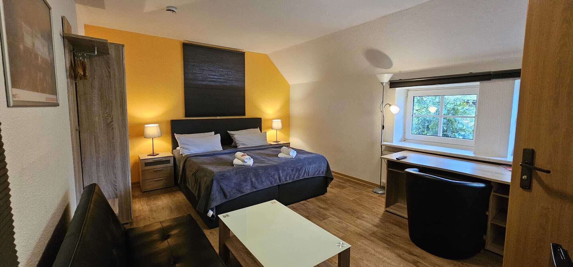 Desk, laptop workspace, blackout curtains, cots/infant beds