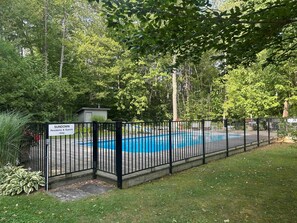 A fenced swimming pool with a sign indicating it is for residents and guests only. - Mad River Valley Modern 3 bedroom & 2 bath Condo; Convenient Location (Warren)