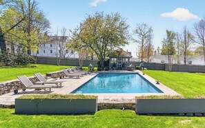 A rectangular swimming pool with lounge chairs and a gazebo in the background. - The 1775 Colonel Benjamin Tallmadge House on the Litchfield Green (Litchfield)