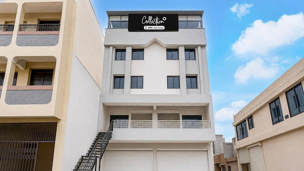 A multi-story building with a sign indicating it is serviced by OVOS. - Collection O Rajkot Central Bus Terminal (Rajkot)