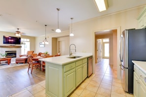 A spacious kitchen with a large island, modern appliances, and a dining area with comfortable seating.
