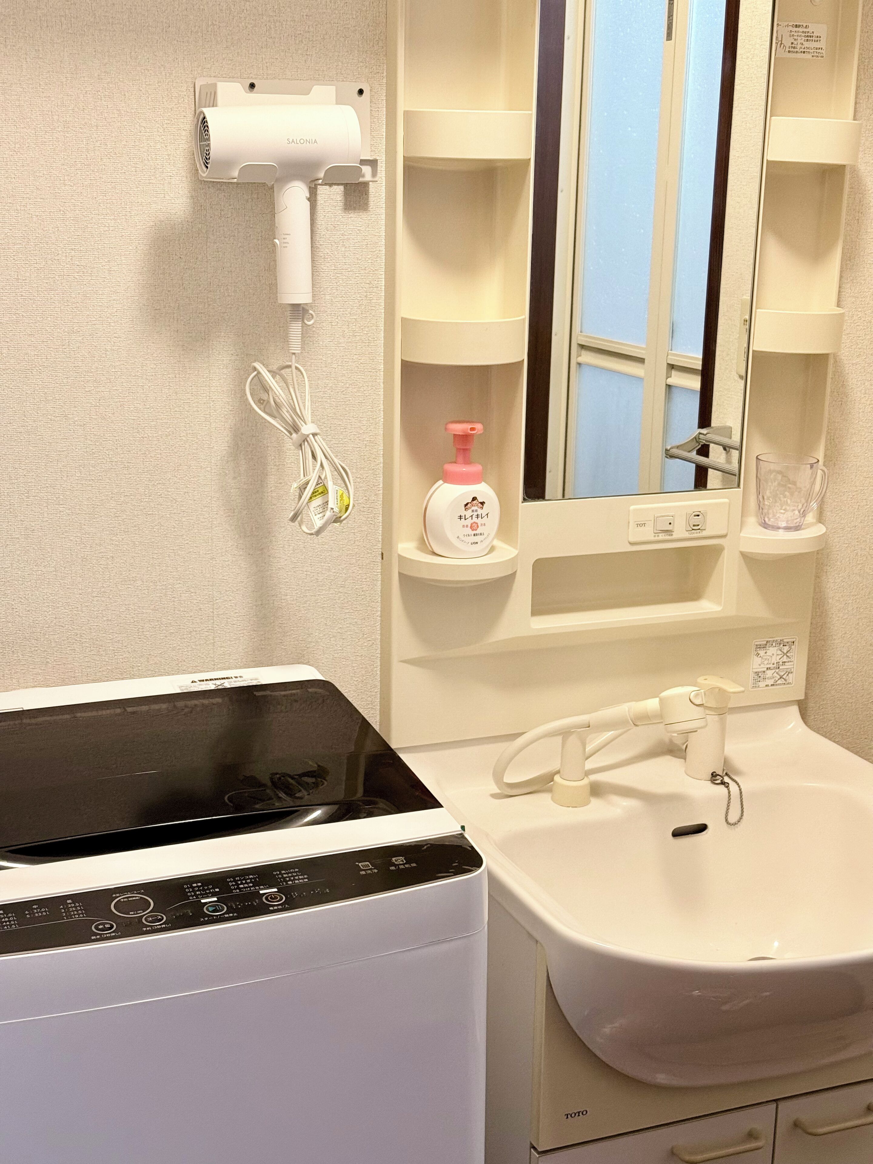 Hair dryer, bidet, towels, soap