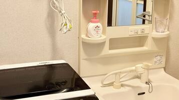 Hair dryer, bidet, towels, soap