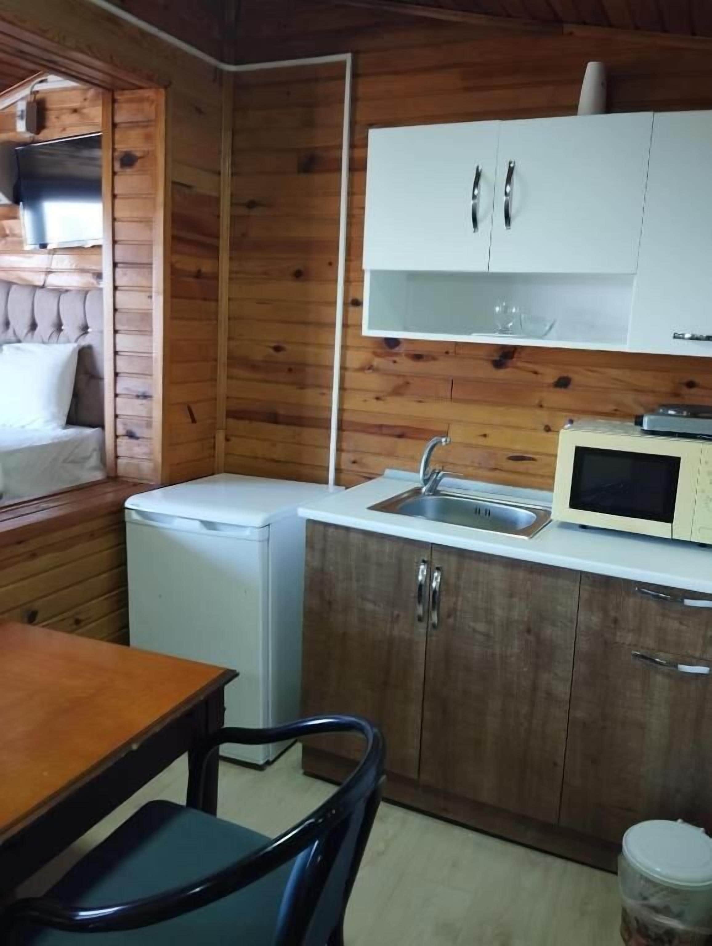 Habitación doble Deluxe, vista al mar | Cocina privada