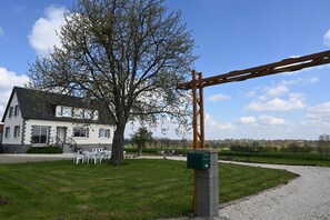 A house with a garden, a wooden pergola, and a gravel path. - Modern Normandy House 7 Bedrooms sleeps 14 (Barenton)