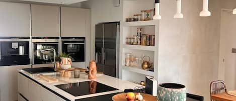 Coffee/tea maker, fridge, microwave, oven