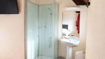 Shower, hair dryer, towels, toilet paper