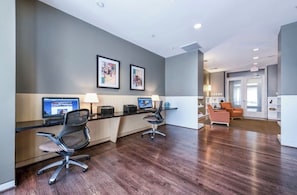 A modern office space with two desks, chairs, and a reception area. - Exceptional Location - Downtown DC, Walk to Shops, Rooftop Pool, Jacuzzi, Gym (Washington)