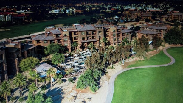 A resort with multiple-story buildings, a parking area, and a golf course. - Cochella 2027, Fri through Mon 4/16-4/19, Westin Desert Willow, Villa Sleeps 4 (Palm Desert)