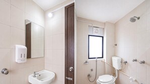 A bathroom with a sink, mirror, toilet, shower, and window. - Collection O Rajkot Central Bus Terminal (Rajkot)