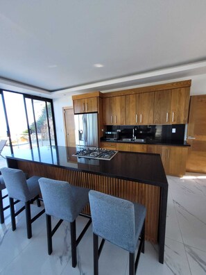 Private kitchen - 3-bedroom house in charming Cabrera with cool AC breeze (Cabrera)