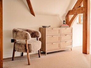 A room with a wooden chair, a wooden dresser, and a window. - Luxury Cotswolds Cottage for 7 (Tewkesbury)
